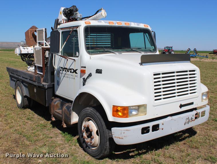 image for item K1916 1994 International 4700LP flatbed truck with environmental drill