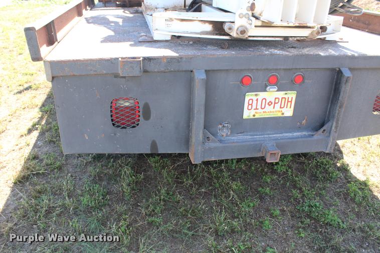 image for item K1916 1994 International 4700LP flatbed truck with environmental drill