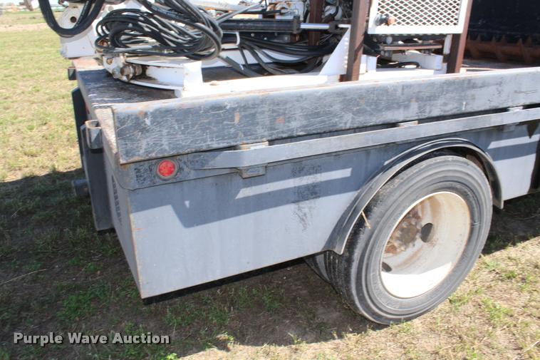 image for item K1916 1994 International 4700LP flatbed truck with environmental drill