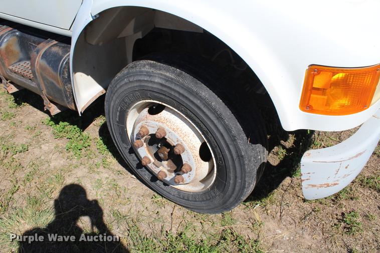 image for item K1916 1994 International 4700LP flatbed truck with environmental drill