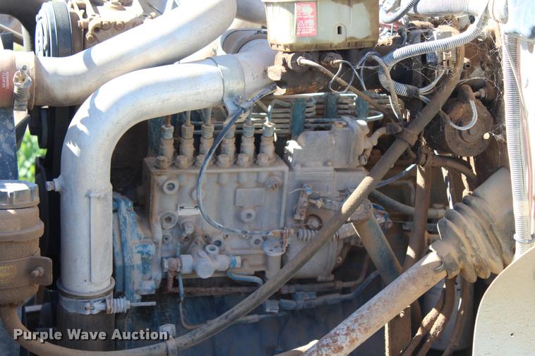 image for item K1916 1994 International 4700LP flatbed truck with environmental drill