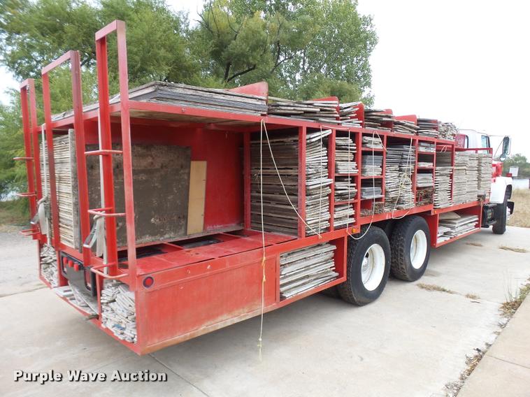 image for item L3284 1992 Ford LNT8000 flatbed truck with concrete forms