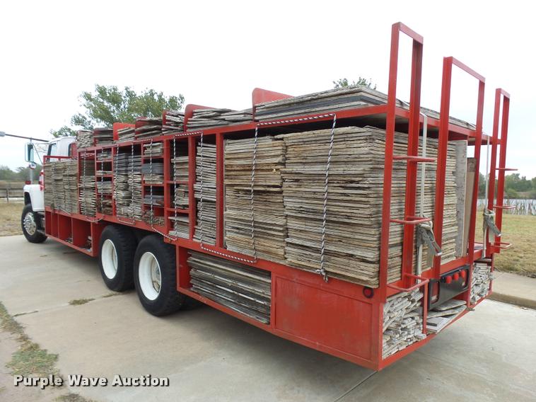 image for item L3284 1992 Ford LNT8000 flatbed truck with concrete forms