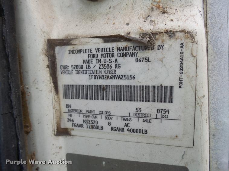 image for item L3284 1992 Ford LNT8000 flatbed truck with concrete forms