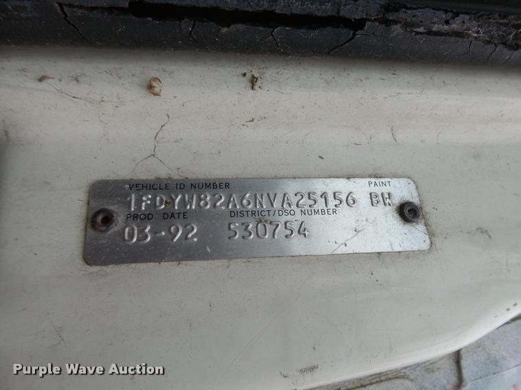 image for item L3284 1992 Ford LNT8000 flatbed truck with concrete forms