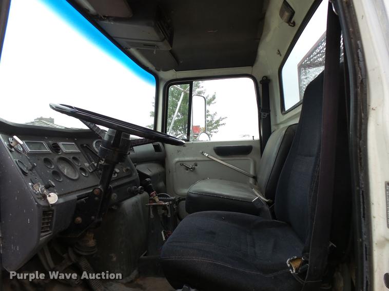 image for item L3284 1992 Ford LNT8000 flatbed truck with concrete forms