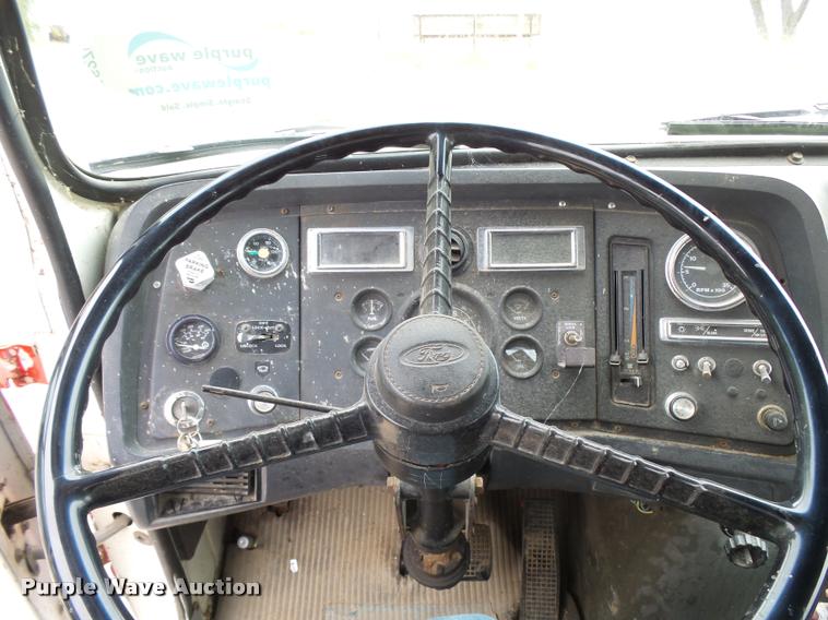 image for item L3284 1992 Ford LNT8000 flatbed truck with concrete forms