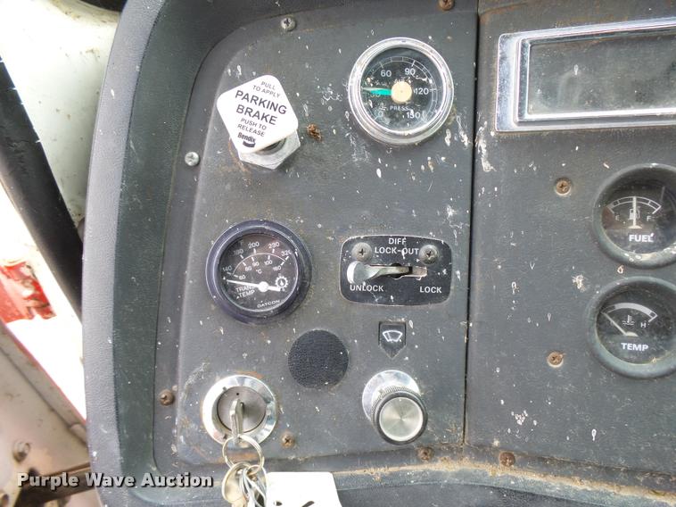 image for item L3284 1992 Ford LNT8000 flatbed truck with concrete forms