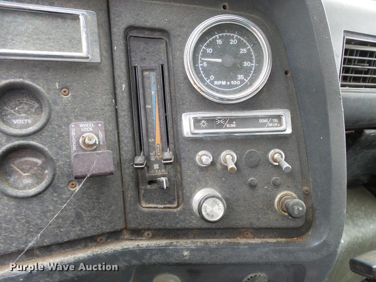 image for item L3284 1992 Ford LNT8000 flatbed truck with concrete forms