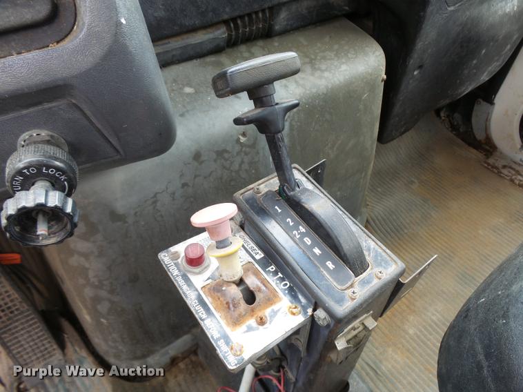 image for item L3284 1992 Ford LNT8000 flatbed truck with concrete forms