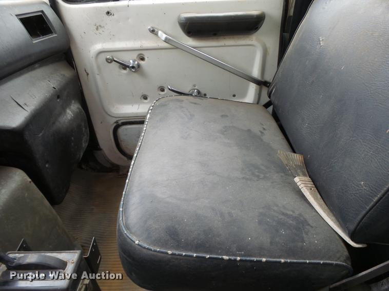 image for item L3284 1992 Ford LNT8000 flatbed truck with concrete forms