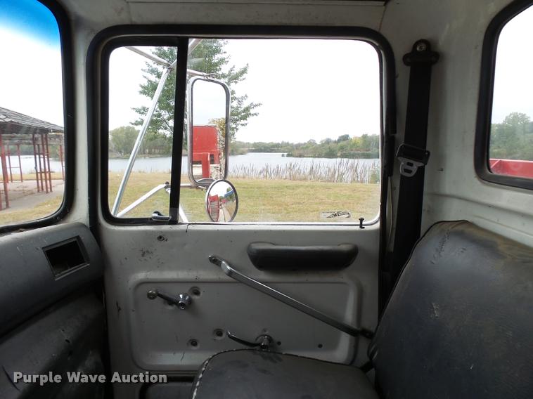 image for item L3284 1992 Ford LNT8000 flatbed truck with concrete forms