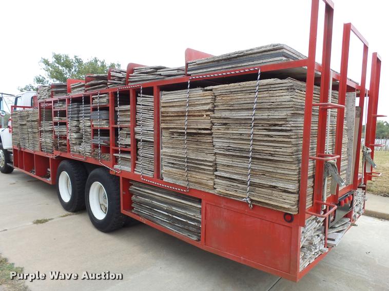 image for item L3284 1992 Ford LNT8000 flatbed truck with concrete forms