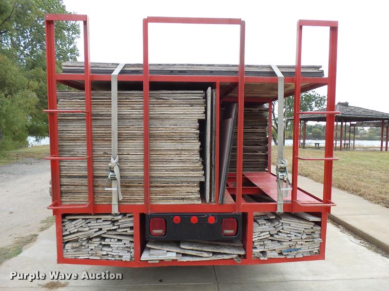 image for item L3284 1992 Ford LNT8000 flatbed truck with concrete forms