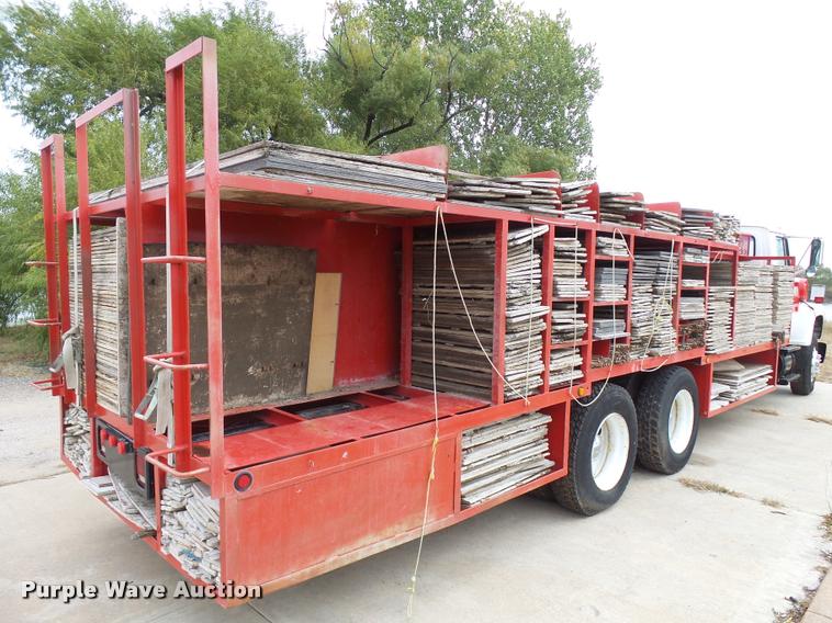 image for item L3284 1992 Ford LNT8000 flatbed truck with concrete forms