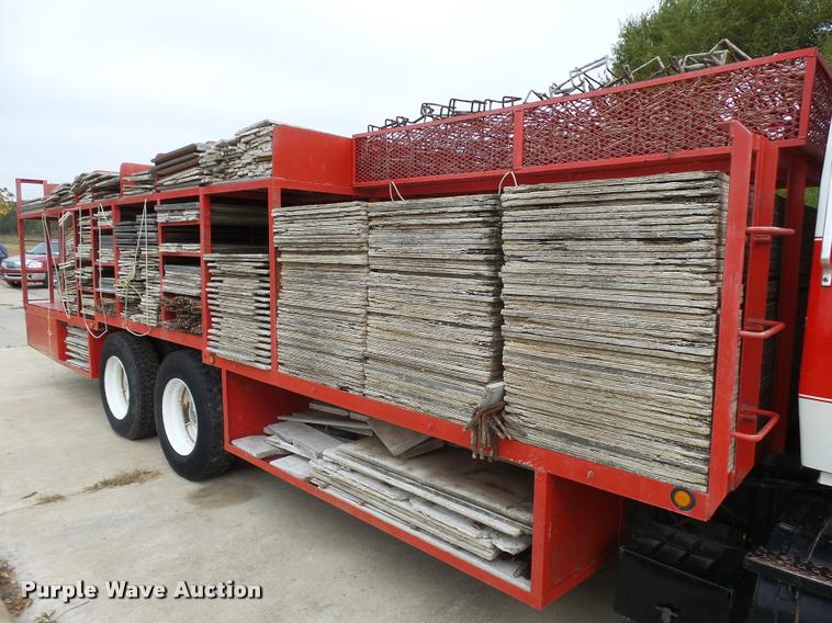 image for item L3284 1992 Ford LNT8000 flatbed truck with concrete forms