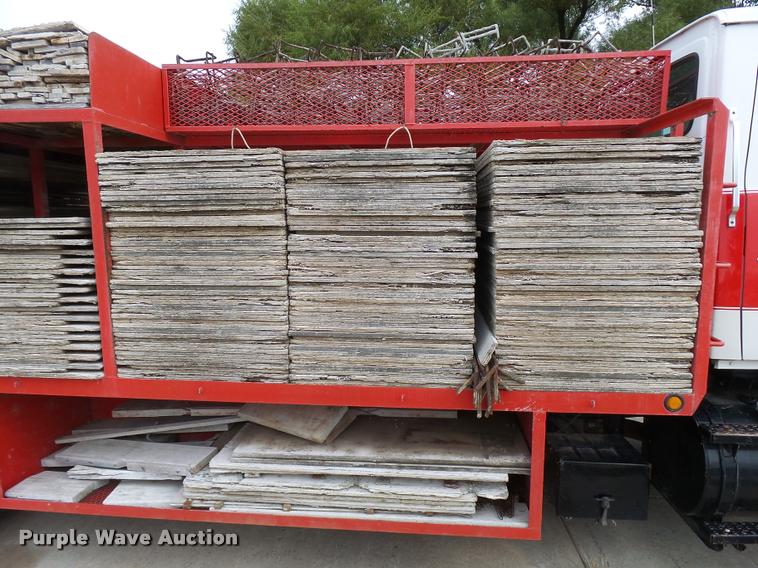 image for item L3284 1992 Ford LNT8000 flatbed truck with concrete forms