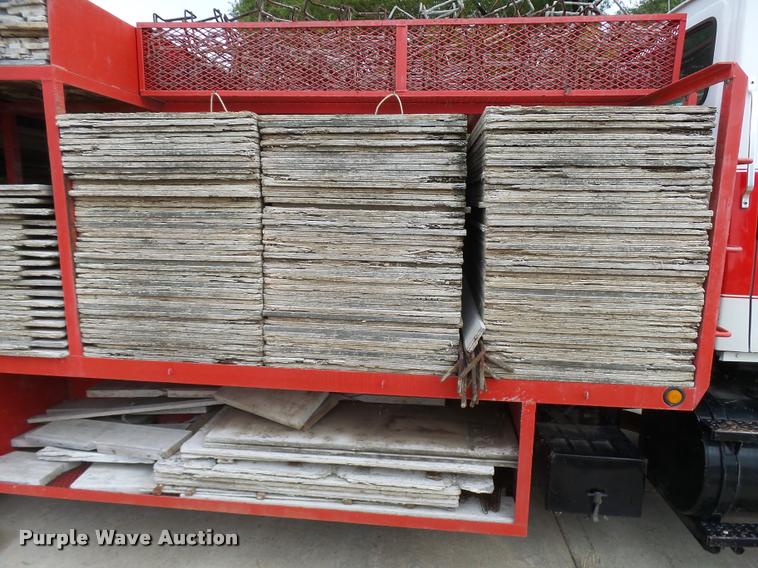 image for item L3284 1992 Ford LNT8000 flatbed truck with concrete forms