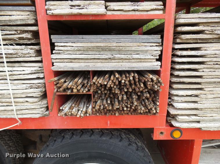 image for item L3284 1992 Ford LNT8000 flatbed truck with concrete forms