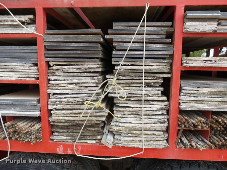 image for item L3284 1992 Ford LNT8000 flatbed truck with concrete forms