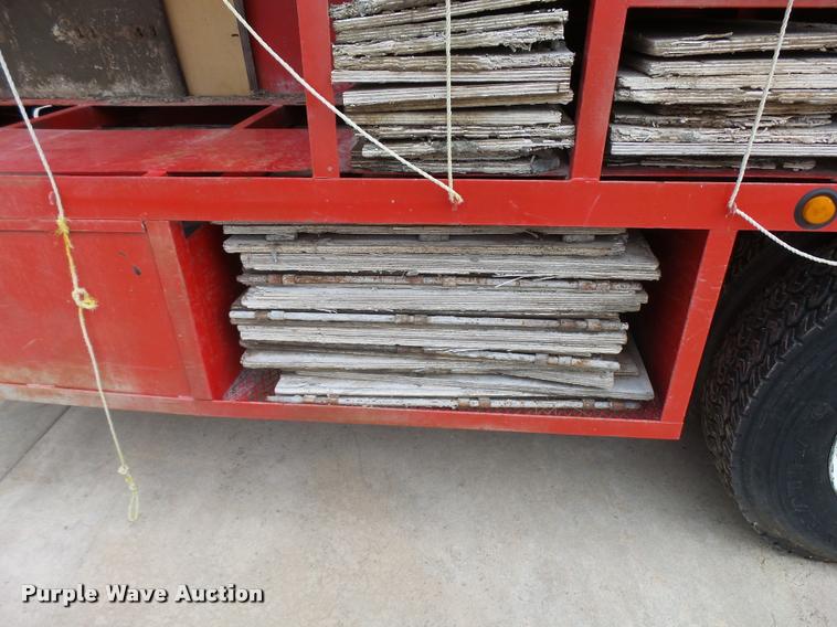 image for item L3284 1992 Ford LNT8000 flatbed truck with concrete forms