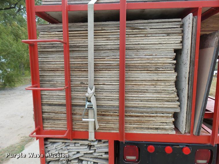 image for item L3284 1992 Ford LNT8000 flatbed truck with concrete forms