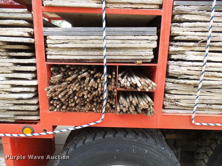 image for item L3284 1992 Ford LNT8000 flatbed truck with concrete forms