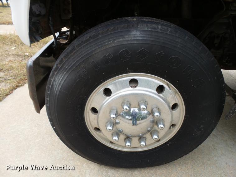 image for item L3284 1992 Ford LNT8000 flatbed truck with concrete forms