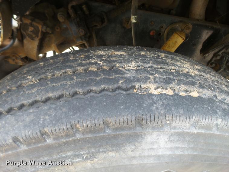 image for item L3284 1992 Ford LNT8000 flatbed truck with concrete forms