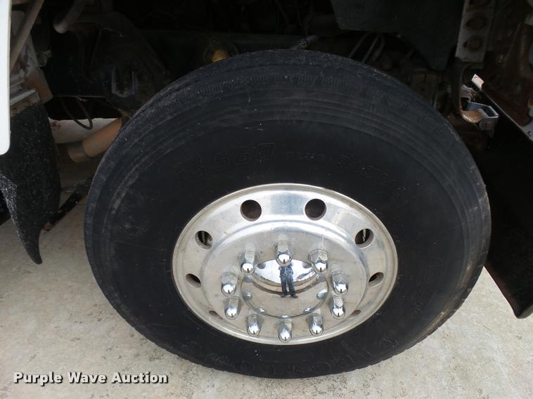 image for item L3284 1992 Ford LNT8000 flatbed truck with concrete forms