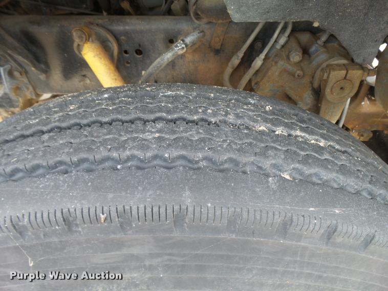 image for item L3284 1992 Ford LNT8000 flatbed truck with concrete forms