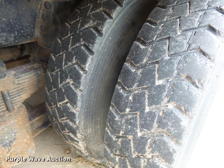 image for item L3284 1992 Ford LNT8000 flatbed truck with concrete forms