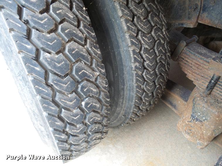 image for item L3284 1992 Ford LNT8000 flatbed truck with concrete forms