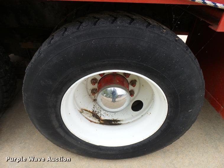 image for item L3284 1992 Ford LNT8000 flatbed truck with concrete forms