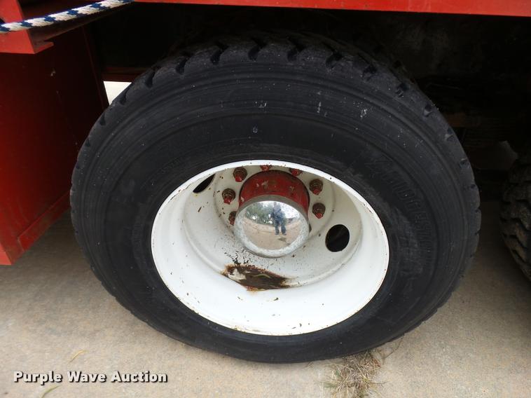 image for item L3284 1992 Ford LNT8000 flatbed truck with concrete forms