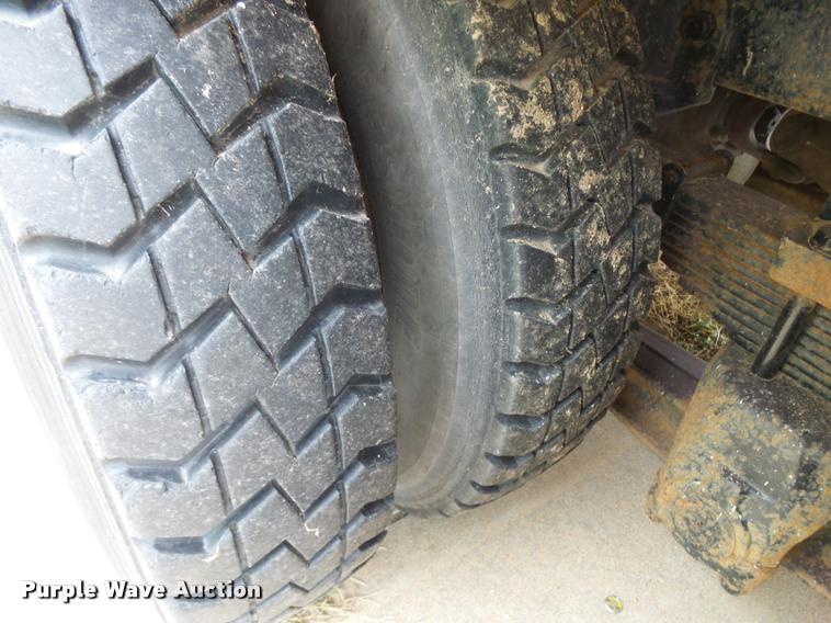 image for item L3284 1992 Ford LNT8000 flatbed truck with concrete forms