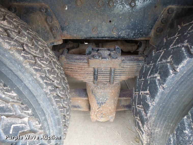 image for item L3284 1992 Ford LNT8000 flatbed truck with concrete forms