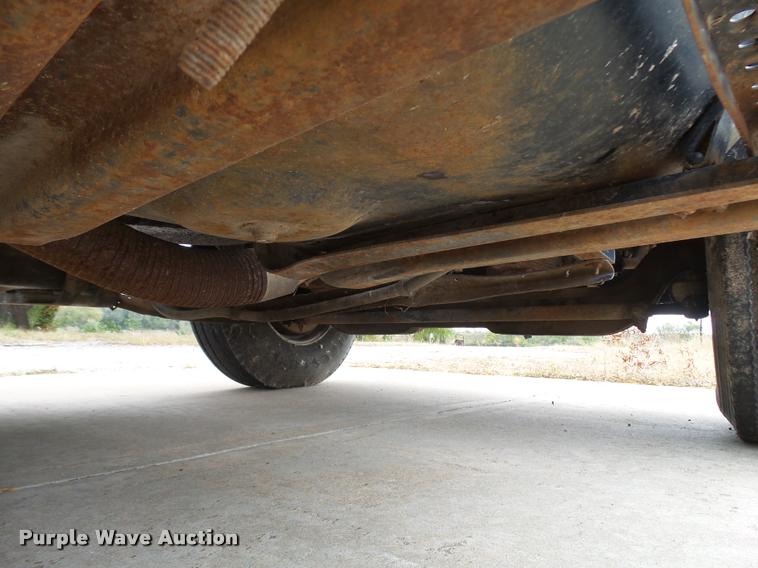 image for item L3284 1992 Ford LNT8000 flatbed truck with concrete forms