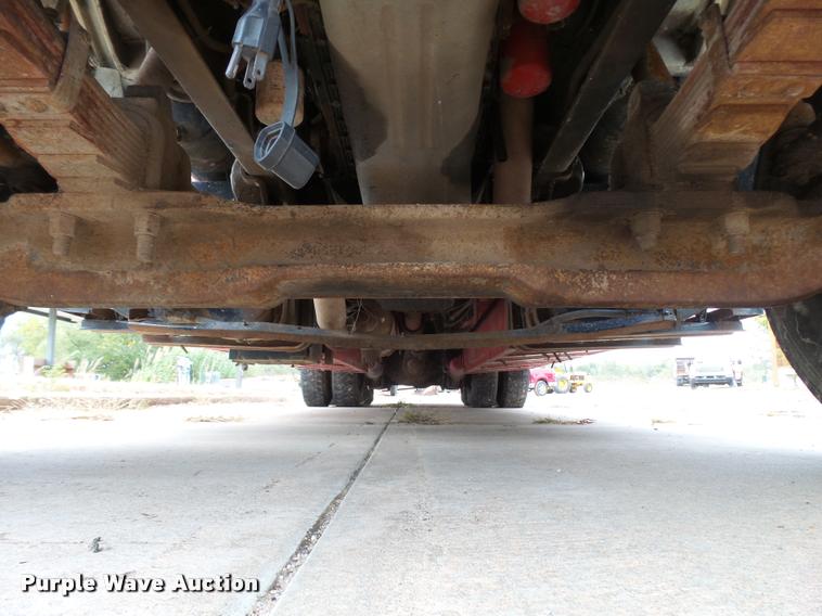 image for item L3284 1992 Ford LNT8000 flatbed truck with concrete forms