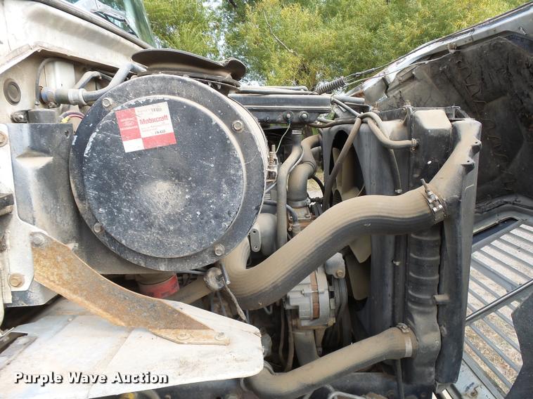 image for item L3284 1992 Ford LNT8000 flatbed truck with concrete forms