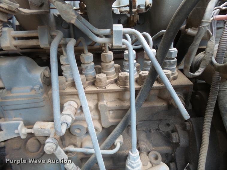 image for item L3284 1992 Ford LNT8000 flatbed truck with concrete forms