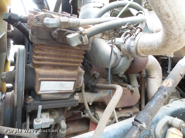 image for item L3284 1992 Ford LNT8000 flatbed truck with concrete forms