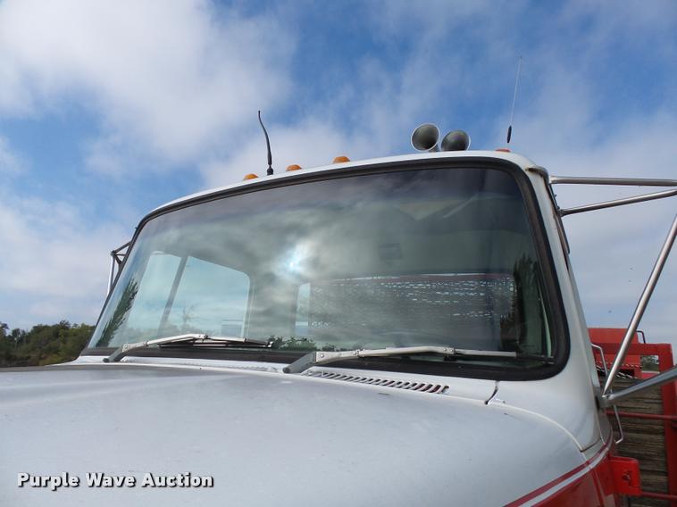 image for item L3284 1992 Ford LNT8000 flatbed truck with concrete forms