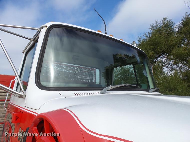 image for item L3284 1992 Ford LNT8000 flatbed truck with concrete forms