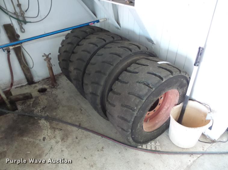 image for item AX9077 (4) skid steer tires and wheels