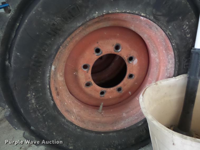 image for item AX9077 (4) skid steer tires and wheels