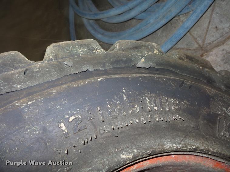 image for item AX9077 (4) skid steer tires and wheels