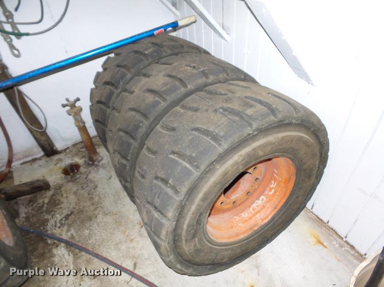image for item AX9077 (4) skid steer tires and wheels
