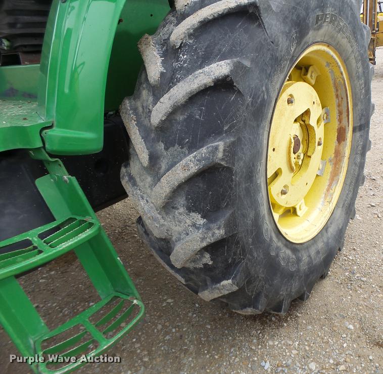 image for item K5596 2003 John Deere 6420 MFWD tractor