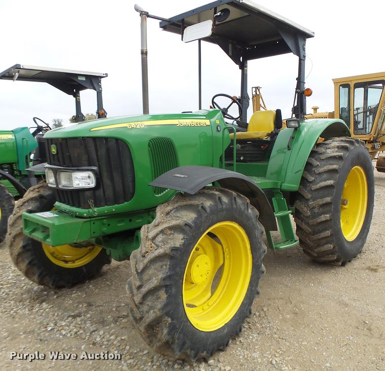 image for item K5597 2002 John Deere 6420 MFWD tractor